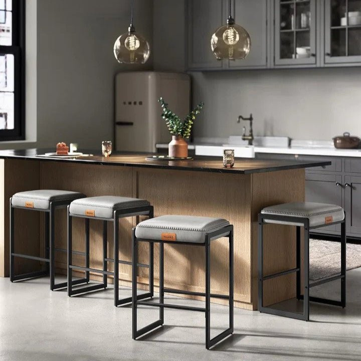 Modern kitchen with bar stools and a vintage refrigerator.